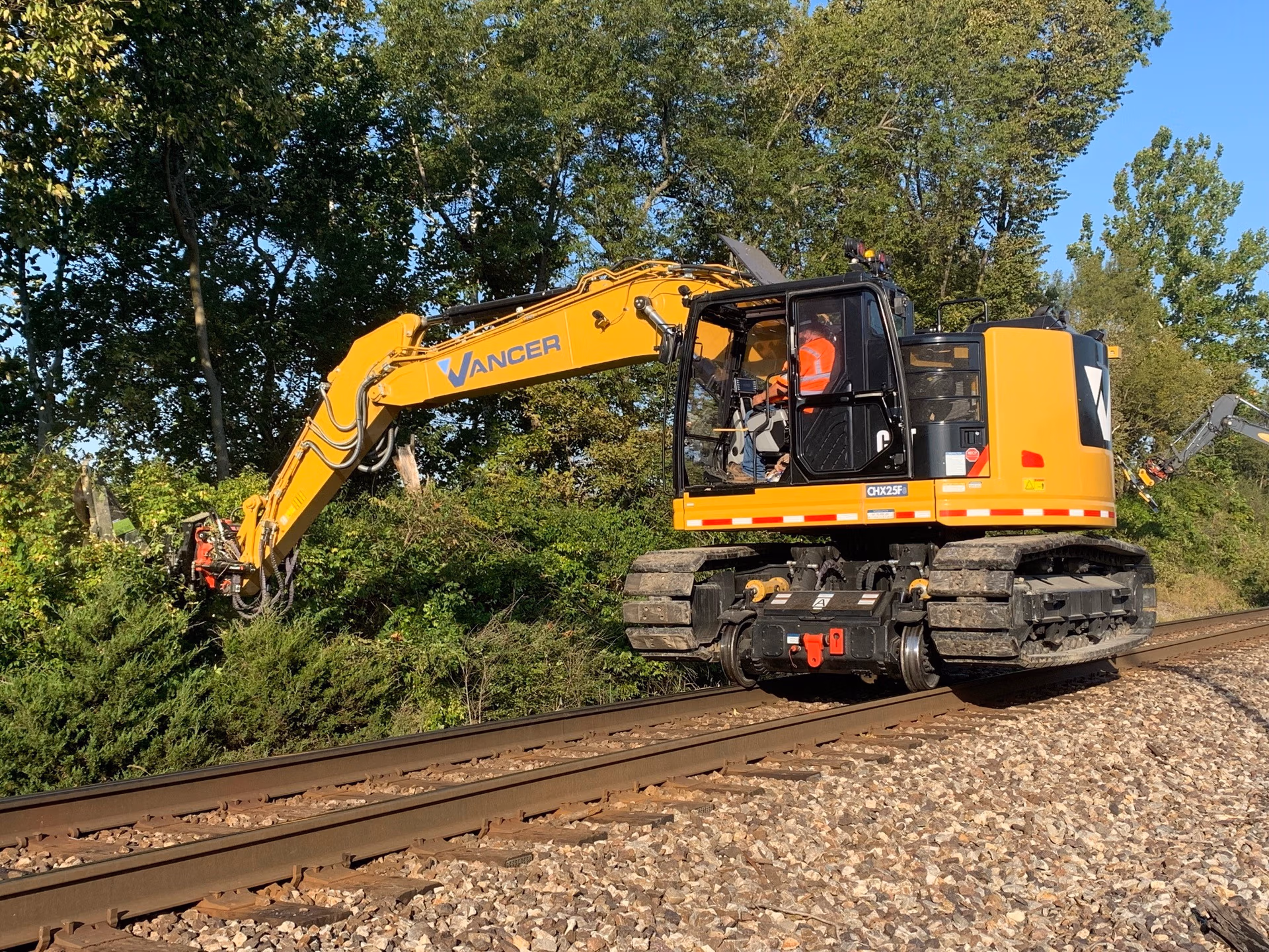 hi rail excavator with brush cutter